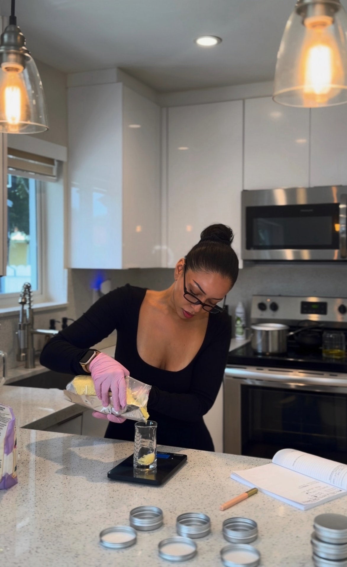 Pamela weighing ingredients in the studio kitchen